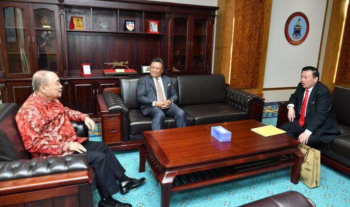 Chief Minister Datuk Seri Hajiji Noor in a light moment with Datuk Abdul Rahman Dahlan (centre) and Professor Datuk Dr Taufiq Yap Yun Hin (right).