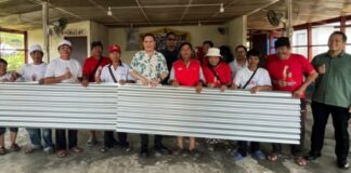 Victor donates 150 sheets of zinc to 10 families in Kg Tangaban